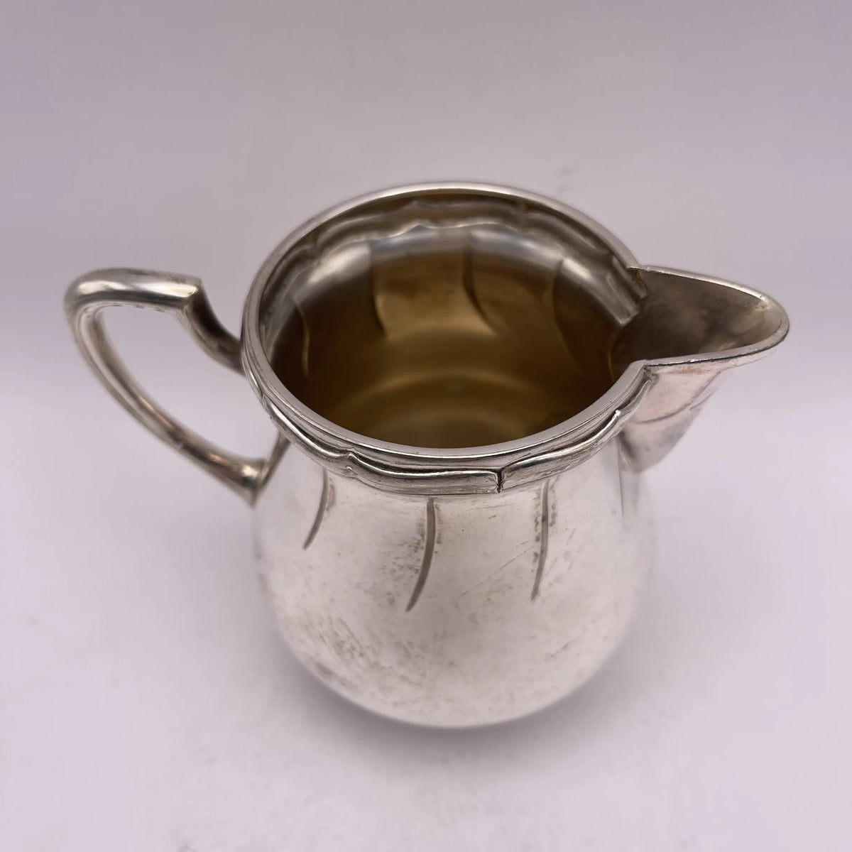 Henry Stratford Ltd / Milk pitcher / 1900-early 1920s / Silver plated / England / Britannia metal, scalloped rim / [Vintage]
